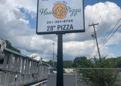 Home of the Satsuma House of Pizza sign